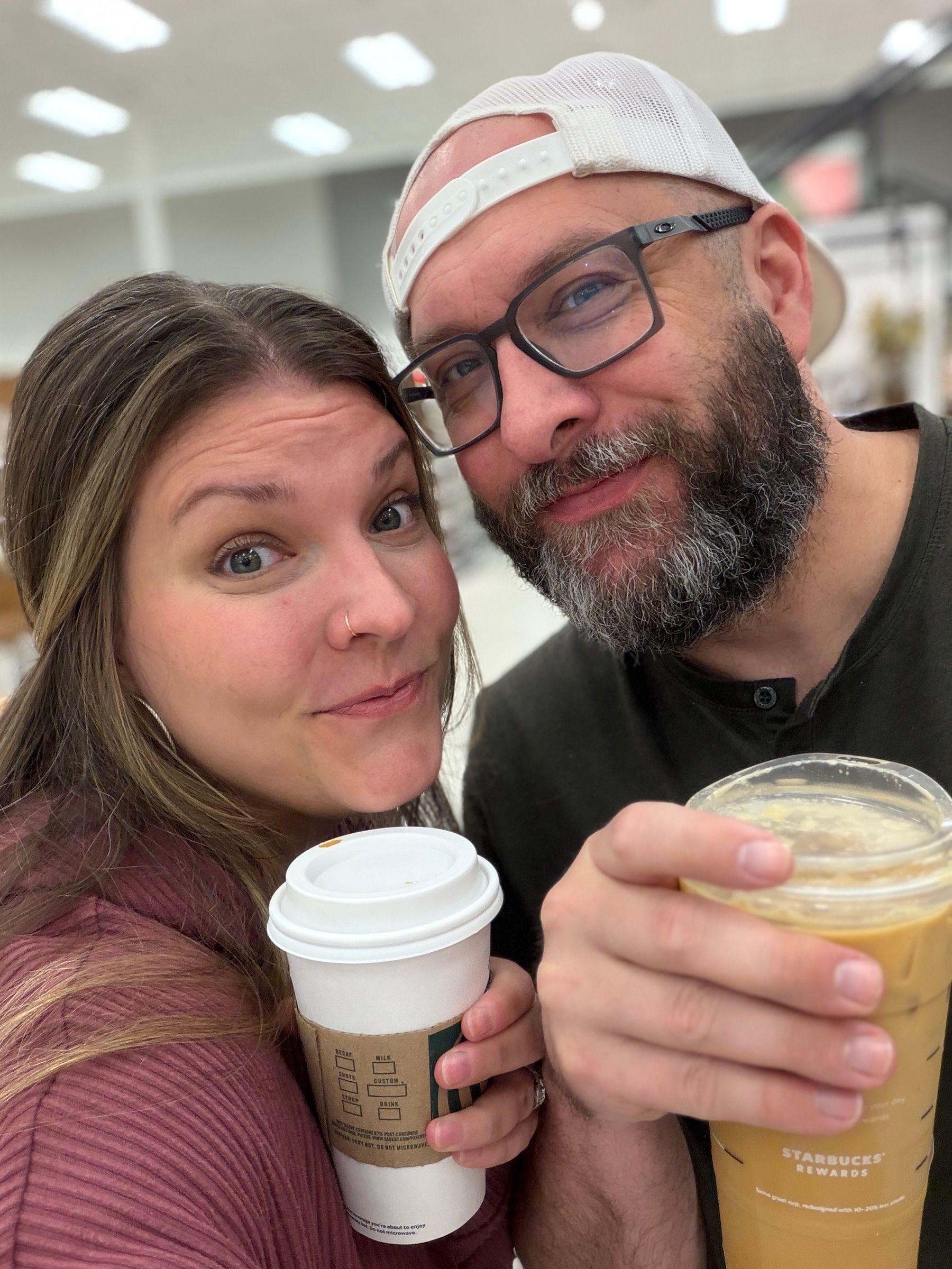 Leah and a man holding coffee cups